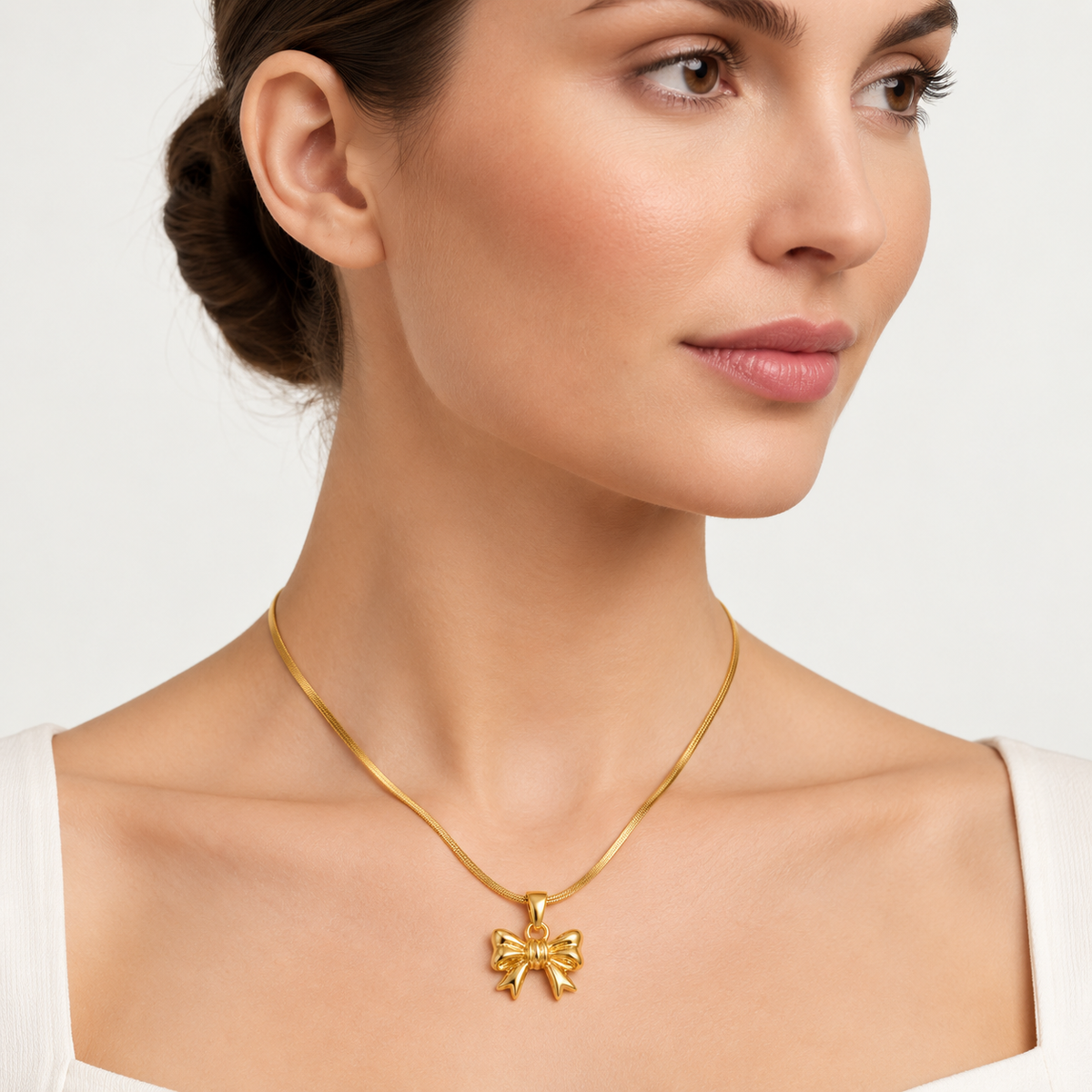 Polished Gold Bow Pendant Necklace